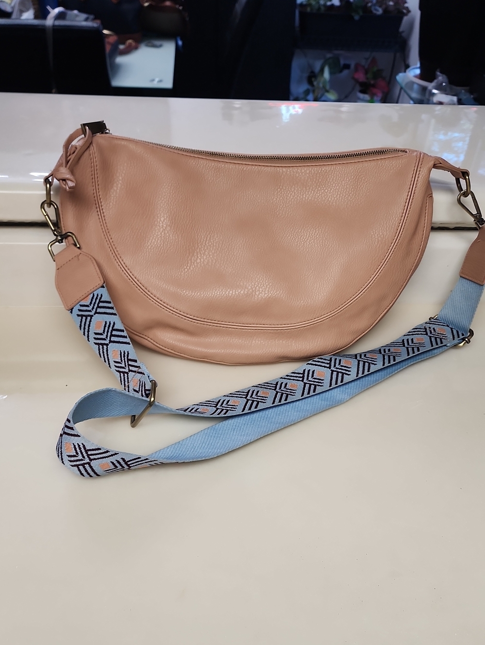 Urban Originals Peach Crescent Crossbody with Patterned Blue Strap